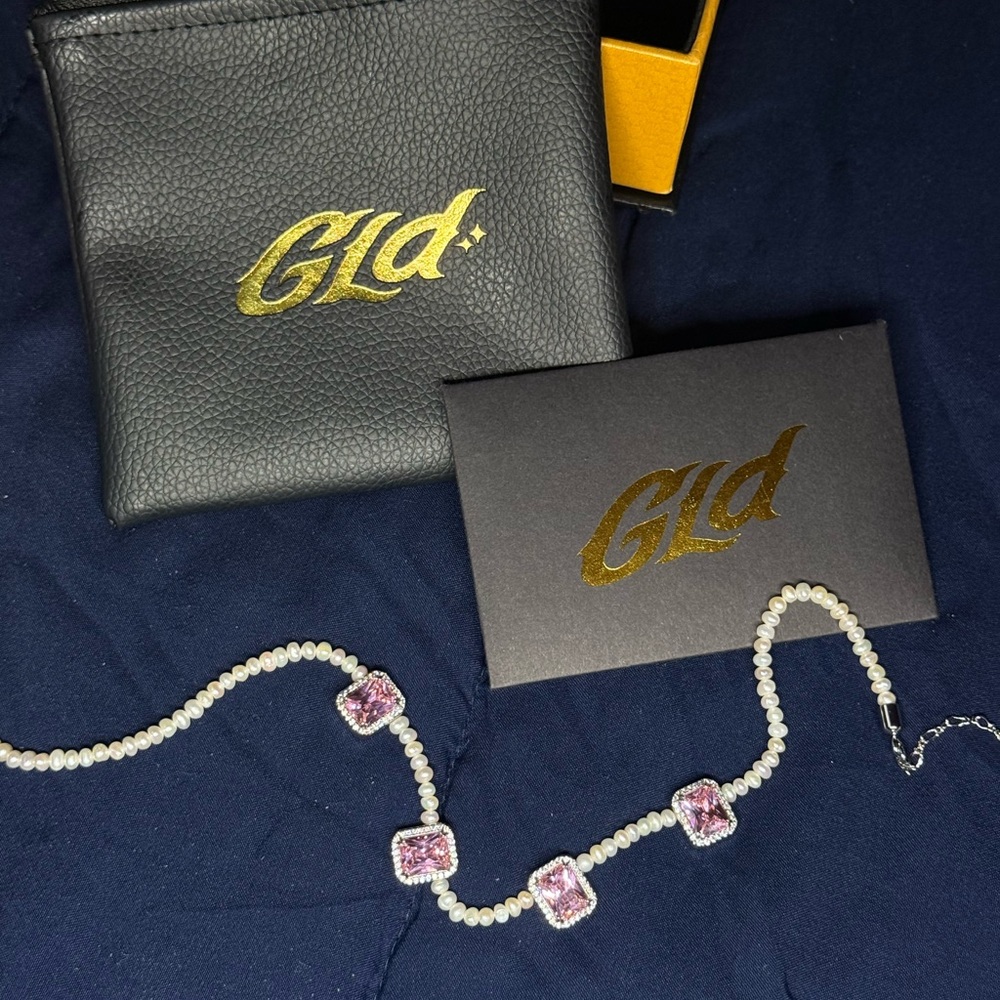 Elegant Pearl Necklace with Pink Gem